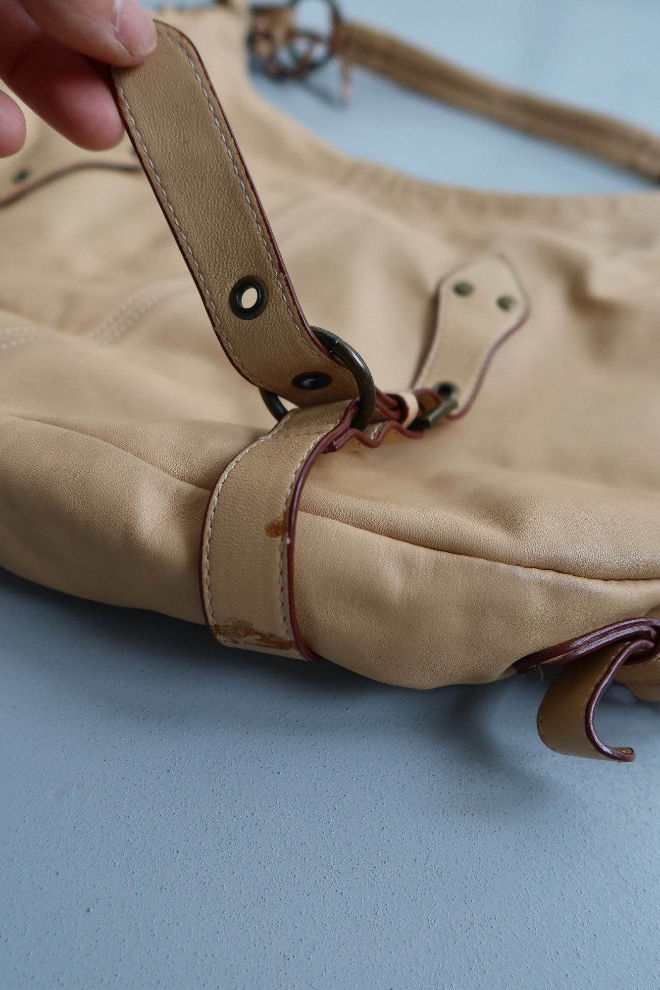 tan leather buckle bag