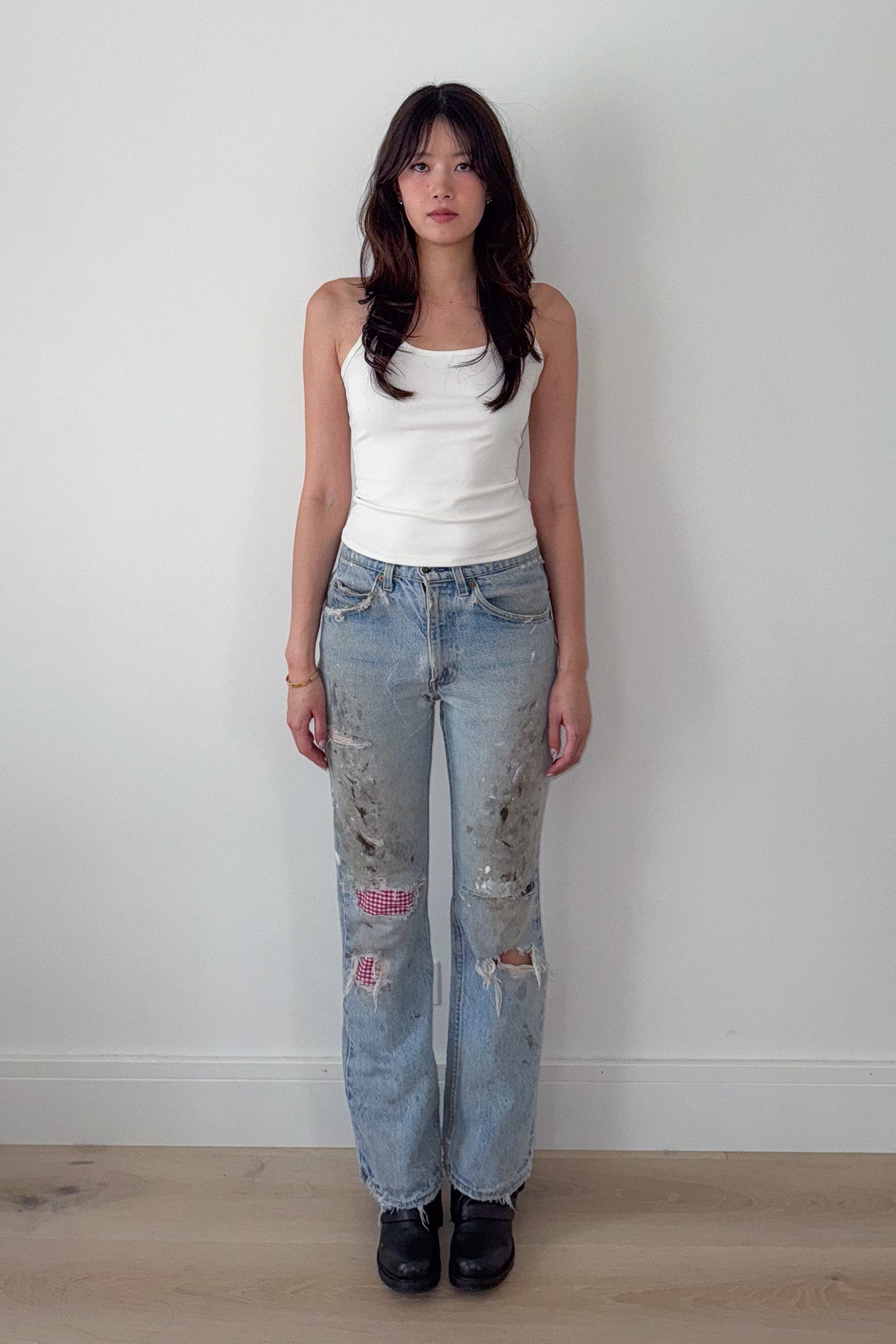 levi's | distressed jeans with gingham repair